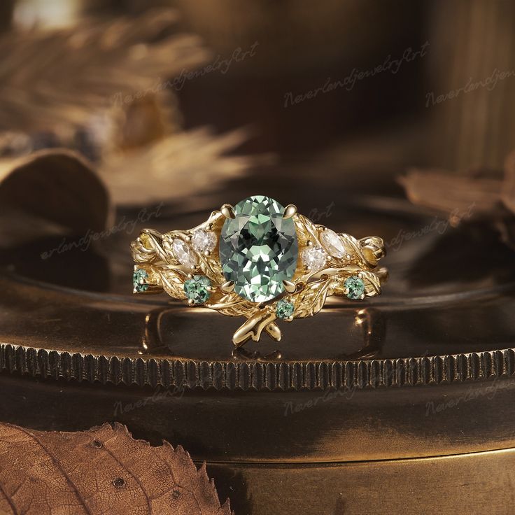 a green ring with leaves and stones on it