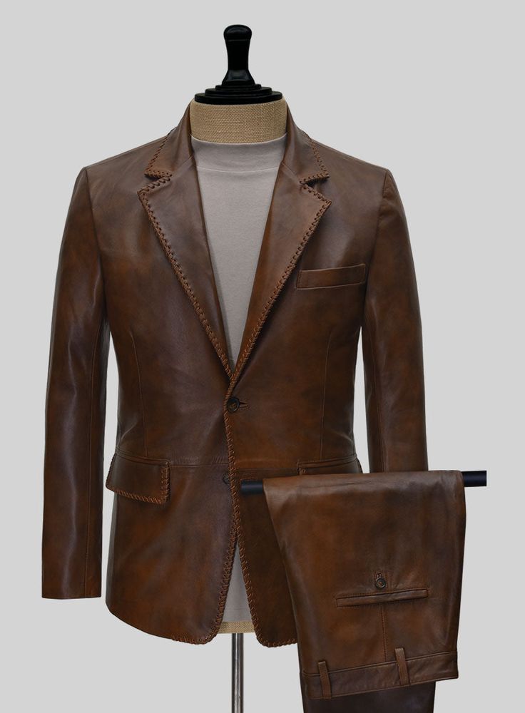 Shake up the fashion scene with our Spanish Brown Medieval Leather Suit. Crafted from genuine napa leather, this trendy suit with edgy lapel stitches elevates your style and establishes you as a fashion pioneer. The rich brown color adds a touch of authority to your sophisticated look. Ideal for any occasion, this fearless suit exudes an irresistible charm that will turn heads. Stand out, make a statement, be yourself!   Look Includes   Spanish Brown Leather  Two Button Jacket Style   Notch Lape Tweed Overcoat, Tweed Sport Coat, Harris Tweed Jacket, Trendy Suits, Best Caps, Brown Blazer, Herringbone Tweed, Green Suit, Linen Suits