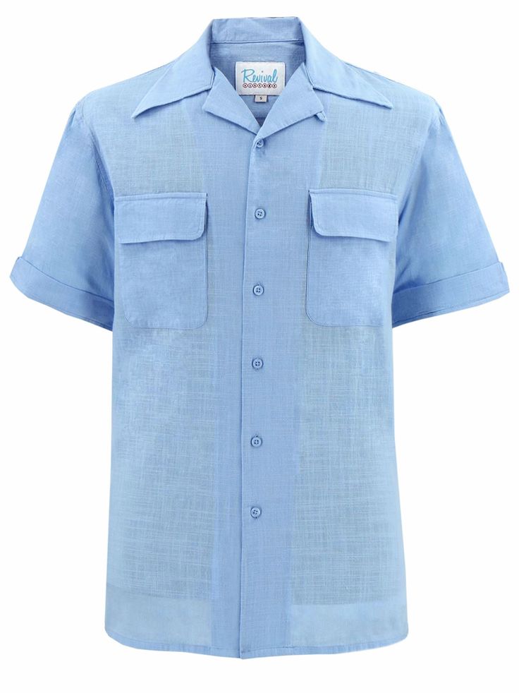 "Based on original photographs and patterns from the 1940s and 1950s, we offer this pure cotton leisure shirt for warmer weather and more casual occasions. This pale blue leisure shirt is an authentic relaxed, open-neck day shirt for those who wish to emulate the fashion of the forties and fifties. Loop and button decor. The fabric is 100% quality cotton. Two patch chest pockets with flaps that have rounded edges. There is a yoke stitched across the back shoulders. The short sleeves have a stitched cuff with central notch detail.  Approx 10\" long. Small slits at the side seams. Care: Machine wash 30 degrees - warm iron. Measurements - Available in 5 sizes.  Small  Chest Best Fit 38-40\" (97-102cm)   Shoulder Width 18\"  Length 29\" ------------------------------------------------  Medium Classic Blue Tops With Welt Pockets, Blue Collared Shirt With Welt Pockets, Blue Short Sleeve Shirt With Spread Collar And Pockets, Blue Short Sleeve Shirt With Spread Collar, Classic Blue Shirt With Pockets, Blue Shirt With Welt Pockets For Summer, Classic Blue Short Sleeve Shirt, Vintage Light Blue Summer Shirt, Vintage Blue Collared Short Sleeve Shirt