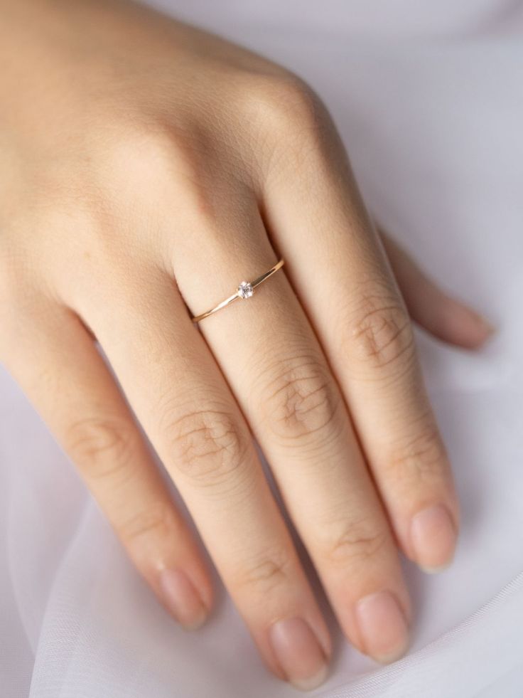 A luminous quintessential beauty. This petite four-prong ring features a sparkling diamond. It's set in a dainty ring that can be worn from day to night. Prong Ring, Very Peri, Sparkling Diamond, Solid Gold Rings, Day To Night, Dainty Ring, To Night, Sparkle Diamonds, Solid Gold