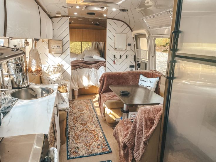 the interior of a camper van is clean and ready for people to use it