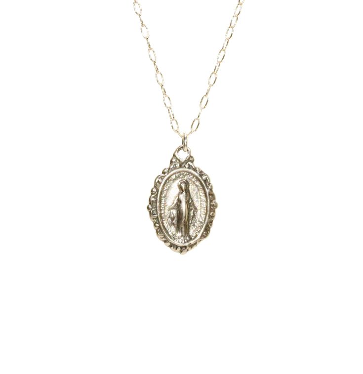 Virgin Mary medallion necklace, miraculous medal necklace, catholic, protection, a sterling silver mother of god on a sterling silver chain This sterling silver Virgin Mary hangs from a sterling silver chain in the length of your choice. This pendant is also available in 14k gold vermeil on a 14k gold filled chain. Charm measurements: 12mmx10mm. Looking for other charm necklaces? https://www.etsy.com/shop/BubuRuby?section_id=12318467 More crystals and healers? http://www.etsy.com/shop/BubuRuby?s Spiritual Oval Miraculous Medal Jewelry And Charms, Spiritual Oval Miraculous Medal Jewelry, Silver Miraculous Medal Jewelry As Gift, Silver Jewelry With Miraculous Medal For Gift, Spiritual Sterling Silver Medallion Locket Necklace, Spiritual Silver Oval Pendant Locket Necklace, Spiritual Miraculous Medal Pendant Jewelry, Silver Necklace With Miraculous Medal For Gift, Miraculous Medal Round Pendant Necklace As Gift