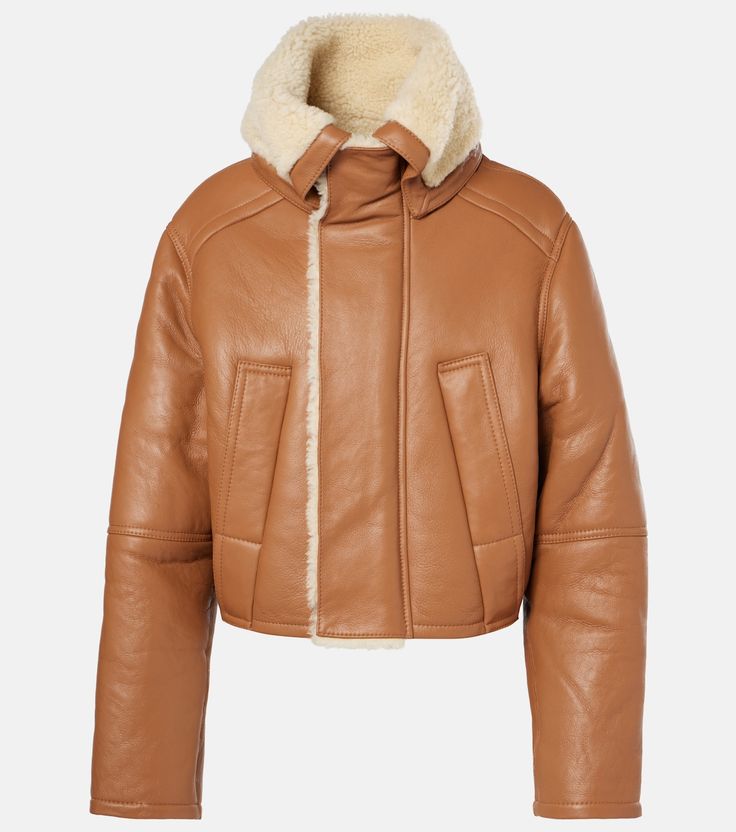 Shearling-lined coat in brown - Victoria Beckham | Mytheresa Classic Leather Jacket With Concealed Fastening For Winter, Brown Winter Outerwear With Concealed Fastening, Modern Beige Leather Outerwear, Fitted Cream Leather Outerwear, Beige Leather Outerwear With Zipper Closure, Classic Beige Leather Outerwear, Beige Leather Jacket With Zipper Closure, Winter Leather Jacket With Concealed Front Fastening, Winter Beige Leather Jacket