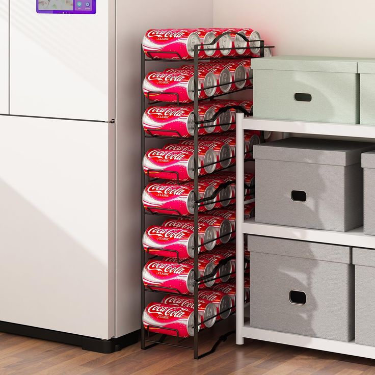 several cans of coca - cola stacked on top of each other in front of a refrigerator