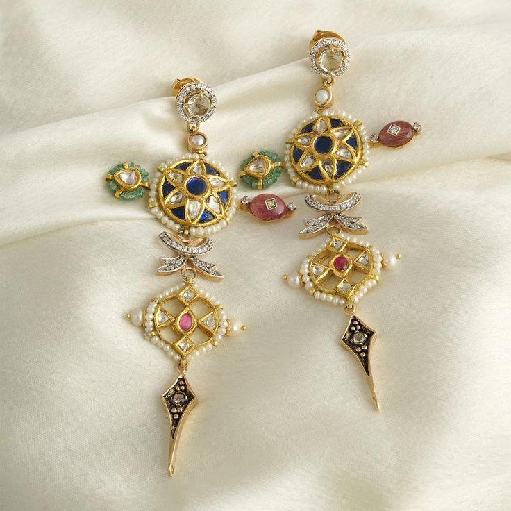 The Arya earrings are a nod to India's celebratory spirit with a chic twist. Featuring individualist units coherently brought together with their shared festive aura, these earrings are handcrafted in gold and set with precious gemstones and cultured pearls. All the units are held together by a stud made in gold and a push-back closure. Stackable Ring Sets, Handmade Packaging, Instagram Famous, Stone Inlay, Uncut Diamond, Precious Gemstones, Ear Studs, Cultured Pearls, Vintage Charms