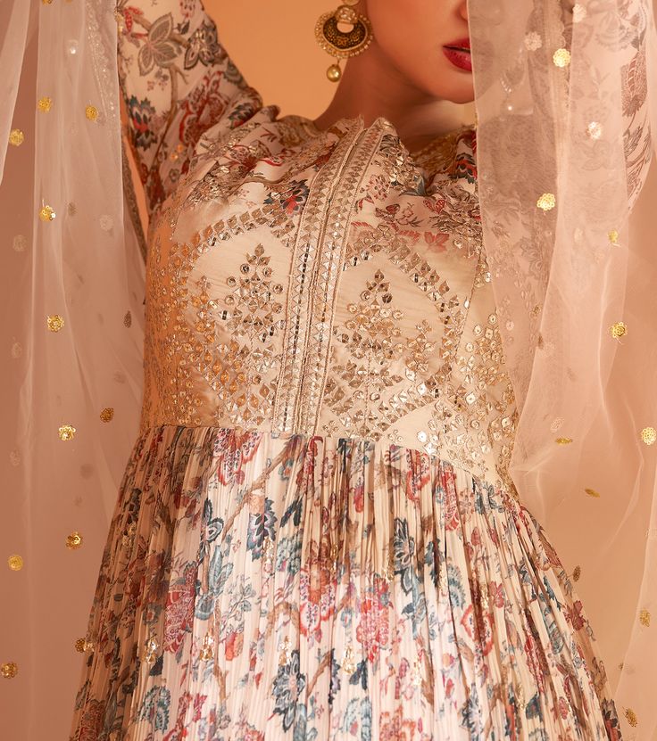 COLOR : Cream Beige FABRIC : Gown - Pure Georgette, Dupatta - Net WORK : Resham Embroidery, Sequins, Digital Floral Print, Lace BorderOCCASION : Wedding, Reception, Mehendi, Engagement, Party Wear, Festival READY-TO-WEAR : No STITCHING : Available as semi-stitched fabric, can be stitched using standard size option (+$20). Note: There might be a slight color variation due to lighting and flash used during photoshoot. The bright shade seen is the best closer view of fabric's color. Beige Anarkali, Floral Print Anarkali, Resham Embroidery, Georgette Dupatta, Holiday Promotions, Anarkali Gown, Net Dupatta, Beige Fabric, Cream Beige