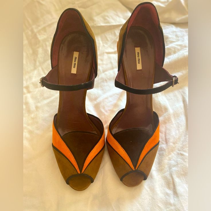 Miu Miu Colorblock Pumps It Size 39. In Box. Never Worn Outside Of The House But Have Been Tried On. - Brown And Orange - Scalloped Accent And Leather Trim - Platform - Suede Exterior And Leather Lining - Strap And Buckle - Heel 5.25” - Made In Italy Never Worn, Still In Box. Suede Has A Few Slightly Lighter Spots Around The Edges, Which I Tried To Capture In The Photos. Designer Open Heel Orange Heels, Designer Orange Open Toe Heels, Designer Orange Pointed Toe Heels, Designer Orange Heels With Pointed Toe, Orange Suede Heels With Round Toe, Leopard Espadrilles, Black Patent Heels, Brown Wedge Sandals, Bow Pumps