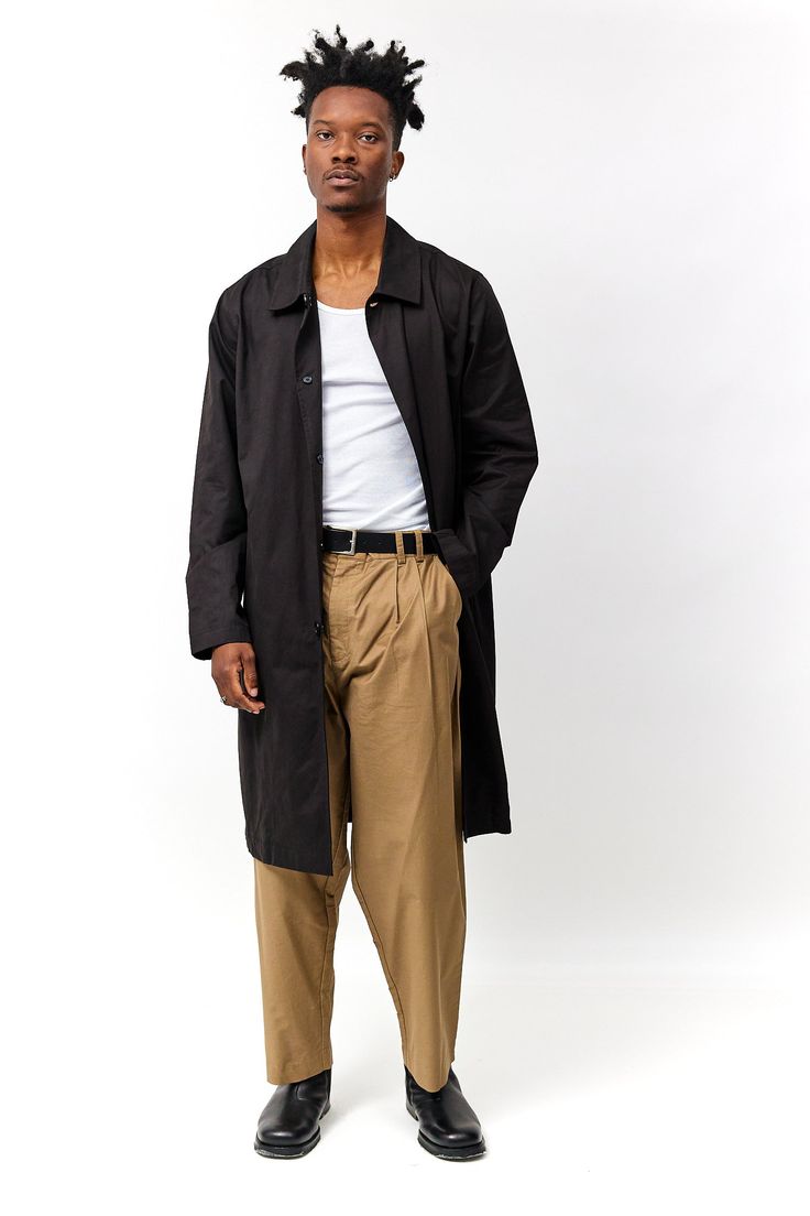 Information The Hays Coat is a men's single-layered trench coat and is made from a lightweight material, making it perfect for transitional seasons or as an outer layer on warmer days. It features large side pockets for extra cargo and a back vent for comfortability. A versatile addition to any wardrobe. Mix and match this piece as a set with The Hays Vest (TA1174) and/or The Hays Jacket (TA1180) during the cool winter days. Details 47% Nylon, 45% Cotton, 8% Polyester Lightweight Side Pockets Al Casual Long Coat Raincoat For Work, Casual Long Raincoat For Work, Gabardine Workwear Raincoat With Pockets, Gabardine Outerwear With Pockets, Business Outerwear With Pockets In Gabardine, Long Cotton Coat With Hidden Button Closure, Cotton Long Coat With Hidden Buttons, Lightweight Trench Coat, Cool Winter