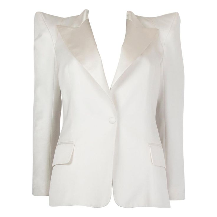 Balmain tuxedo blazer in off-white cotton (51%), polyester (39%), and silk (100%). With satin peak collar, peak shoulders, two flap pockets on the sides, and buttoned sleeves. Closes with one fabric-lined button on the front. Lined in off-white satin silk (100%). Has been worn and is in excellent condition. Tag Size 40 Size M Shoulder Width 44cm (17.2in) Bust From 90cm (35.1in) Waist From 74cm (28.9in) Hips From 94cm (36.7in) Length 60cm (23.4in) Side Seam Length 42cm (16.4in) Sleeve Length 55cm Off White Blazer, Balmain Blazer, White Louis Vuitton, Structured Jacket, Crepe Blazer, Tuxedo Blazer, Military Style Jackets, Cocktail Evening Dresses, Silk Jacket