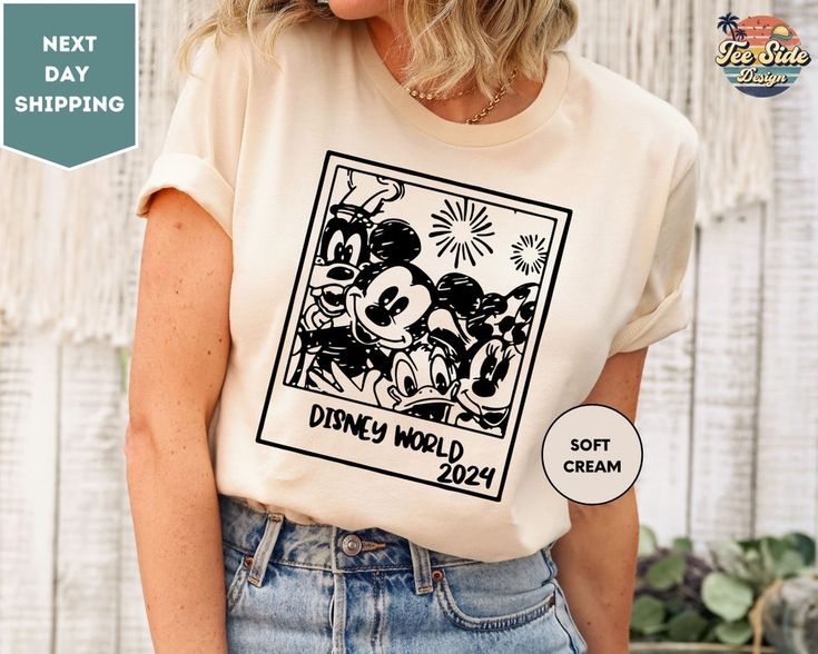 a woman wearing a t - shirt with an image of mickey mouse