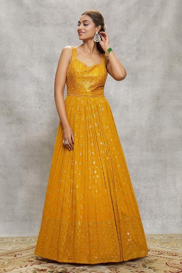 Yellow padded anarkali with sequin and mirror embroidery and attached cancan. Paired with an embroidered dupatta.
Components: 2
Pattern: Embroidered
Type Of Work: Sequin, Mirror
Neckline: Leaf
Sleeve Type: Sleeveless
Fabric: Anarkali: Georgette, Dupatta: Net
Color: Yellow
Occasion: Mehendi and Haldi - Aza Fashions Sequin Anarkali, Anarkali Georgette, Yellow Anarkali, Anarkali With Dupatta, Leaf Sleeve, Mirror Embroidery, Georgette Dupatta, Types Of Work, Embroidered Dupatta