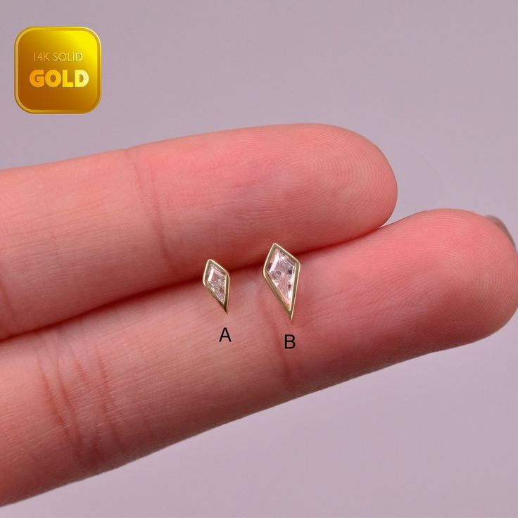 Metal: 14k solid gold, Available Gold color: Yellow gold  Guaranteed Authentic : 14K Solid Gold, Not Gold Plated, Gold filled Stone:  CZ Thickness:0.82mm (20G) Stamp:14k ★Every ear is different, the length of backings that most suitable for your ear will depend on your ear thickness ★Titanium is a very safe metal, so we don't plate it, in order to avoid some people are allergic to the plating material. NOTE The item combined by 14k solid gold and implant grade titanium push in back,  packed in a beautiful Jewelry Box   SHIPPING ADDRESS All the orders will ship to the supplied address through your Etsy Order, Please leave your phone number,will give to carrier for safe deliver. We will not send and replacement parcels due to incomplete or inaccurate address.  PACKING ●Can be Gift packed inc Gold Diamond Earrings With Diamond Eyes For Anniversary, Gold Piercings With Diamond Accents In 14k Gold, 14k Gold Piercings With Diamond Accents, Dainty Gold Piercings With Diamond Accents, 14k Gold Diamond Cut Diamond-shaped Earrings, Gold Cartilage Earrings With Diamond Accents For Anniversary, 14k Gold Cartilage Earrings With Diamond Accents, Marquise Gold Earrings With Diamond Eyes, Gold Diamond-shaped 14k Earrings