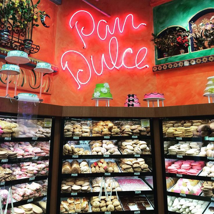 a display case filled with lots of different types of doughnuts and pastries