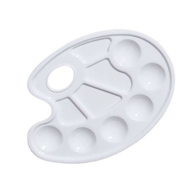 a white plastic tray with holes in it