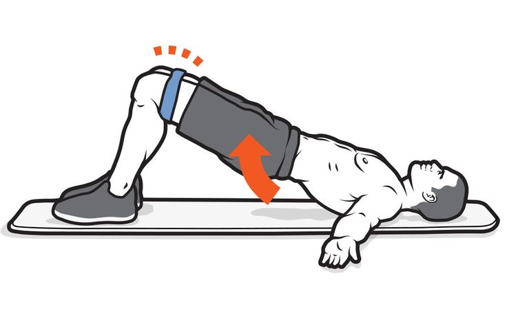 a man doing push ups on a mat with an orange arrow pointing to the side