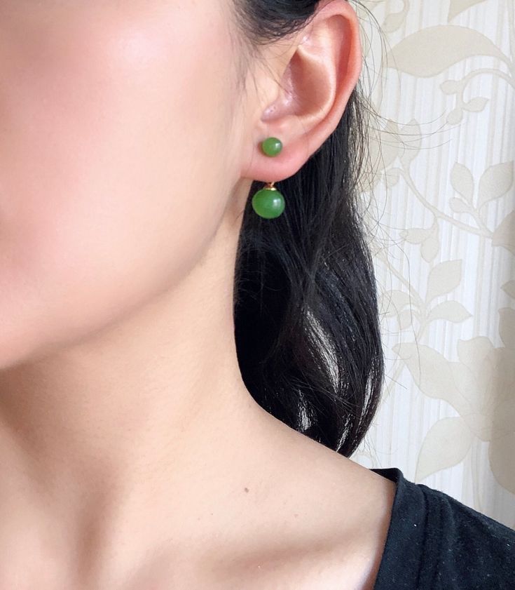 A pair of delicate green stud earrings that are made from 100% natural jade and 925 sterling silver. The smart designs made it can be used in both ways. You can wear them as lovely hanging jade drop earrings. If the drops are removed, they can be used as simple jade studs. A quality gift for yourself or your loved ones. Multi-use works well on all sorts of occasions, no matter it's a fun dating night or day-to-day office wear. Some highlights of this pair of cute green jade hanging earrings are: Affordable Jade Round Bead Earrings, Green Jade Earrings For Pierced Ears, Green Gemstone Round Bead Earrings, Green Gemstone Earrings With Round Beads, Green Minimalist Pierced Earrings, Minimalist Green Pierced Earrings, Hypoallergenic Green Round Bead Earrings, Green Minimalist Dangle Earrings, Spring City