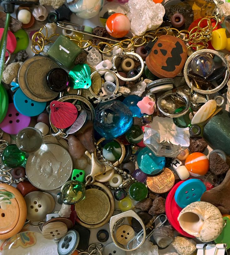 a pile of assorted buttons and other items that are laying on top of each other