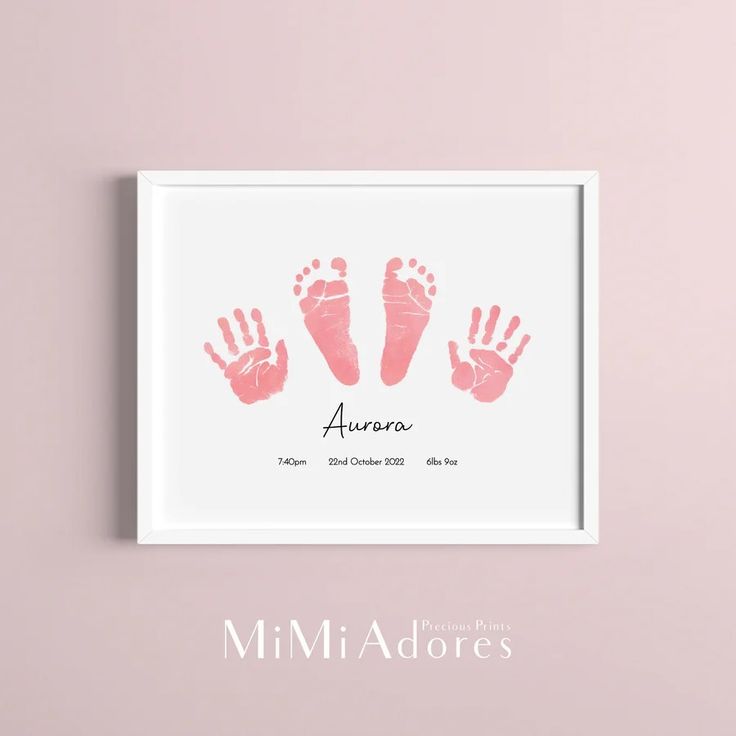 a pink hand and foot print on a white background with the words,'aurora '