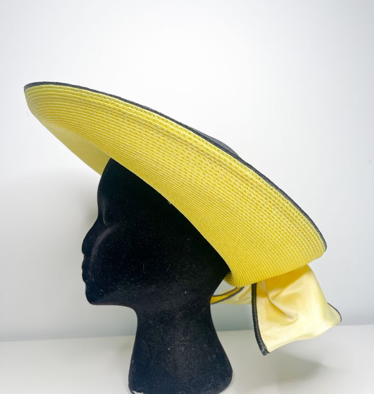 "Beautiful vintage, David M hat. Hat is a buttery yellow and black colour way. This gorgeous hat features a matching yellow satin van with black trim detailing. This is an exquisite example of formal hat wear. Can be worn for for variety of occasions the boat in the back elevates the look of the hat from ordinary to luxury. In perfect vintage condition there is no stains no missing pieces just perfect waiting to be added to your collection. Inside circumference: 20.5\"  Brim:  14.5\" W x  12\"L Yellow Short Brim Hat For Royal Ascot, Yellow Church Fascinator With Short Brim, Yellow Short Brim Fascinator For Church, Adjustable Yellow Hats For Royal Ascot, Adjustable Yellow Hat For Royal Ascot, Yellow Brimmed Fitted Fascinator, Adjustable Yellow Hats For Church, Fitted Yellow Hat For Races, Yellow Adjustable Hat For Church