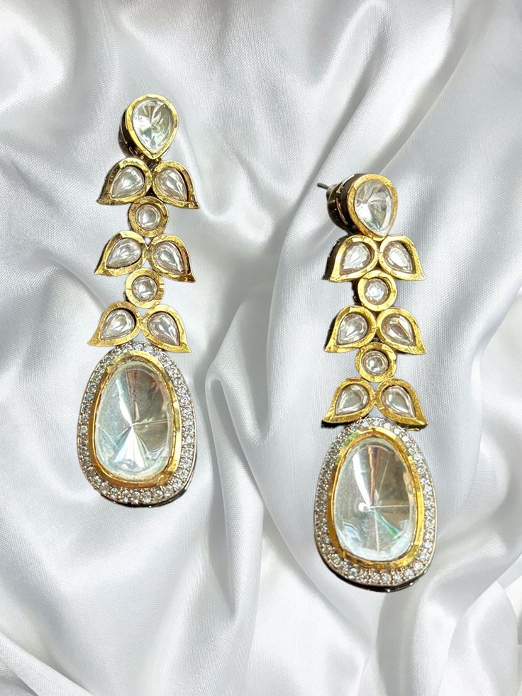 Beautiful uncut polki vintage earrings with gold diamond work and a modern luxurious look for any jewelry lover! The earrings are inspired by the royal princely states of rajasthan and have handwork done with diamond work added for a luxurious look! This lightweight and elegant earring is perfect for any bridesmaid, bride, sangeet or any occasion or event as a gift for any occasion as any one who loves jewelry will love this statement piece. It has beautiful colors that really make the set a statement piece. There are 4 colors available in these earrings and each of them are made with the highest quality stones. Product Details: * Earrings  Ready to Ship and available immediately if you place an order today! Fast Shipping US Customers receive your order within 5-7 business days. This is th Luxury Gold Jhumkas With Stone Work, Luxury Gold Plated Bridal Earrings With Meenakari, Luxury Hand Set Bollywood Earrings, Elegant Kundan Chandbalis For Festive Occasions, Elegant Kundan Bridal Earrings With Stone Work, Elegant Gold Chandelier Earrings With Rose Cut Diamonds, Elegant Kundan Chandbali Chandelier Earrings, Elegant Kundan Bridal Earrings For Festive Occasions, Festive Kundan Necklace With Matching Earrings For Formal Occasions