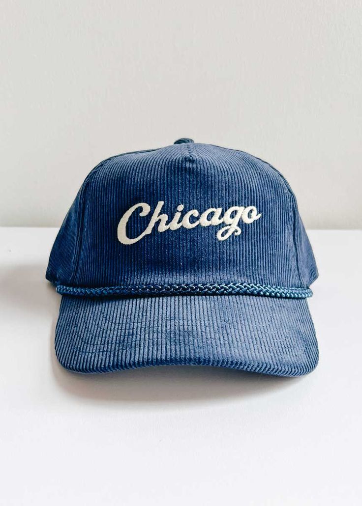 *Alice & Wonder Exclusive* Corduroy 5-panel hat with soft structured crown and slight curved visor. Braided nylon cord across seam and plastic adjustable snap closure. Featuring a matte embroidered 'Chicago' on the front. Cheap Blue Casual Snapback Hat, Cheap Navy Trucker Hat With Curved Brim, Cheap Trendy Flat Bill Baseball Cap, Adjustable Trucker Hat With Embroidered Logo And Flat Brim, Vintage Adjustable Snapback Hat With Curved Brim, Adjustable Snapback Trucker Hat With Embroidered Logo, Adjustable White Trucker Hat, Retro Adjustable Dad Hat With Embroidered Logo, Adjustable Hat With Embroidered Logo And Curved Brim