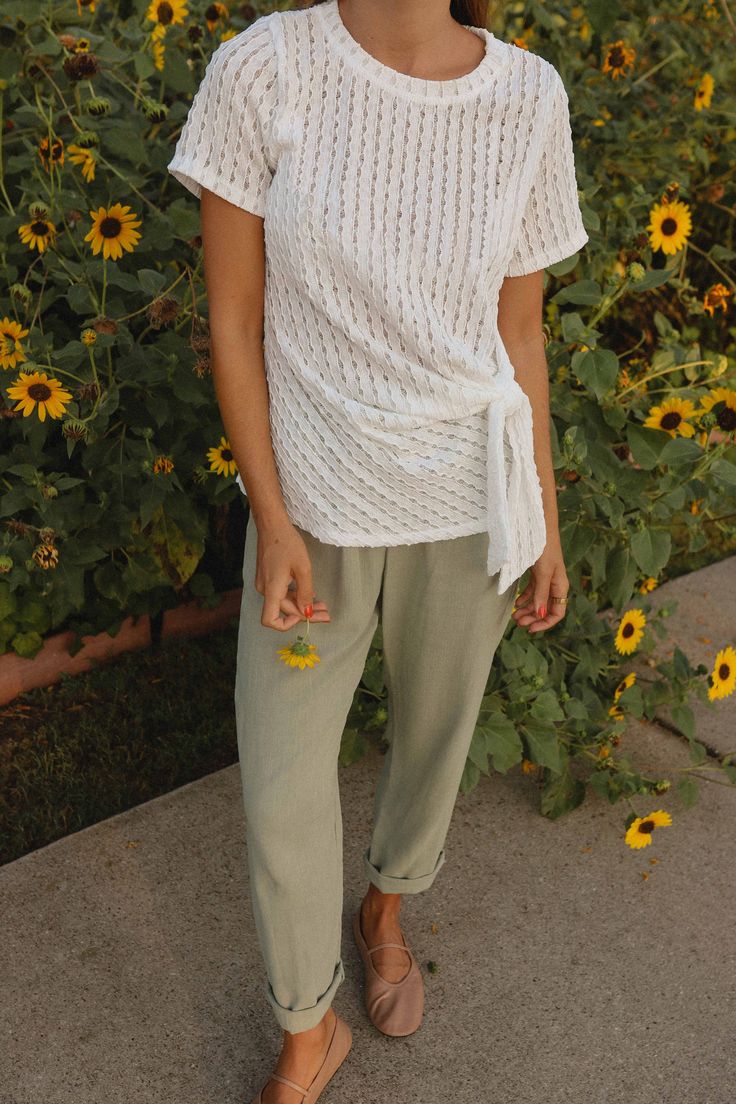 Linen GoodnessWith a structured and yet delicate cut, these pants are our new go-to for the season. Easily paired with a simple cute tee or cropped blouse, sneakers are flats! Materials & Care - Content: 78% Rayon, 22% Linen- Care: Machine wash cold, tumble dry low, cool iron if needed- Made in the USA Size & Description - Made in the USA- Elastic on the waist- High rise waist- Side Pockets- Model is wearing size S Effortless White Bottoms For Spring, Effortless White Spring Bottoms, Breezy Spring Pants For Day Out, Casual Pants For Spring Day Out, Casual Spring Pants For Day Out, Effortless Cotton Pants For Spring, Spring Breezy Cotton Pants, Breezy Cotton Pants For Spring, Effortless Spring Pants For Everyday