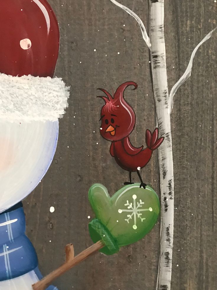 a painting of a snowman holding a green heart next to a white birch tree