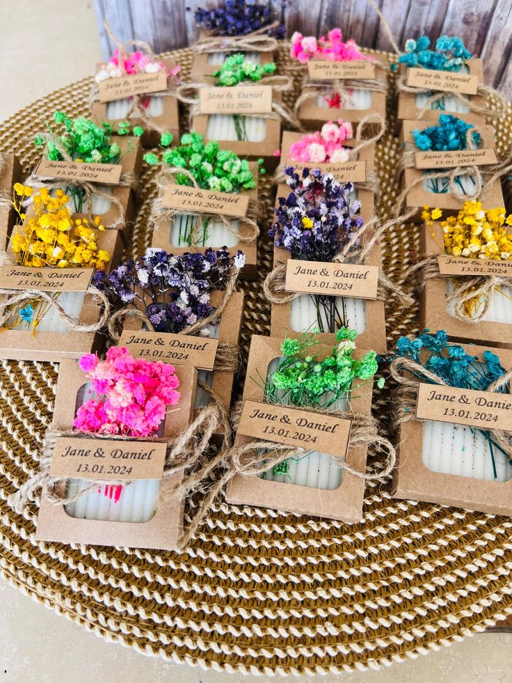 small candles are wrapped in brown paper and tied with twine