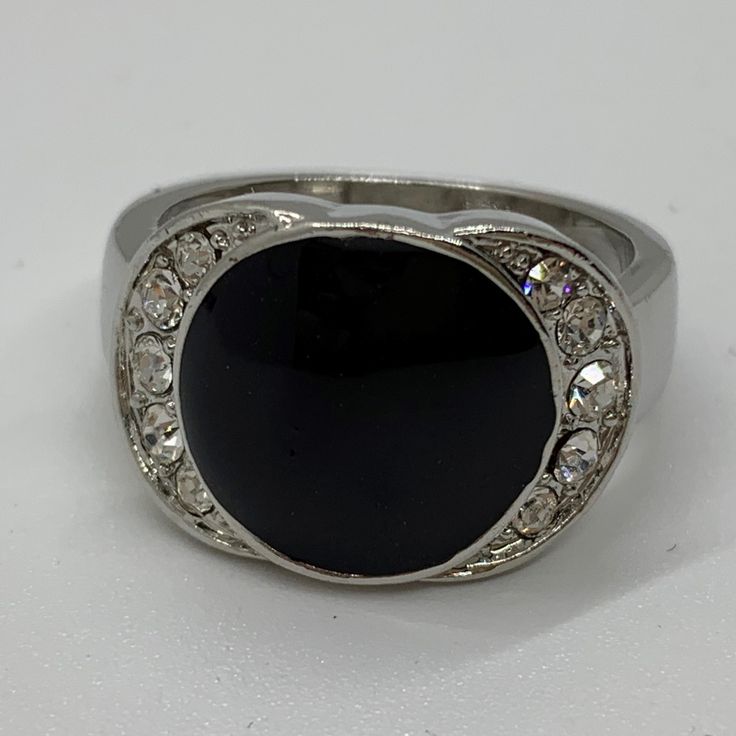 Elegant Silver Ring With Black Onyx Stone Size 8 Stone Size: 1/2" X 3/4" All Items On Poshmark Are New Unless Otherwise Noted. Black Sterling Silver Rings For Party, Silver Rings With Black Diamonds, Modern Black Round Jewelry, Modern Black Rings For Evening, Black Diamond Metal Jewelry, Silver Ring With Polished Finish For Evening, Black Metal Crystal Round Ring, Classic Black Crystal Ring, Black Round Metal Jewelry