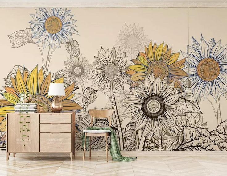 an artistic wall mural with sunflowers painted on the walls and in front of a dresser