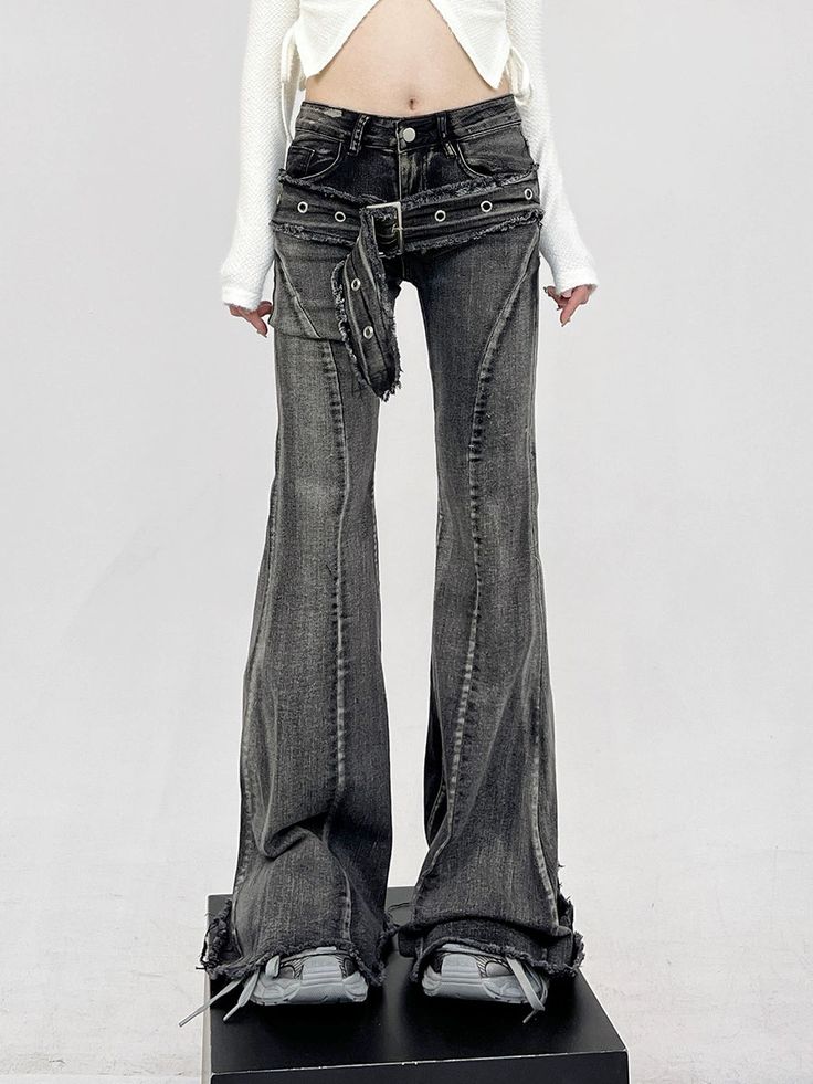 Infuse your wardrobe with a dash of rebellion with our Layered-Effect Denim Flare-Leg Jeans, complete with a grommet belt detail for that extra edge. Crafted from premium denim, these jeans are characterized by their layered look and skinny yet flared silhouette, promising to deliver both comfort and attitude. The intricate grommet belt detail not only accentuates the waist but also adds a unique, punk-inspired aesthetic that sets these jeans apart from the ordinary. Elevate your casual daywear Alternative Style Fall Jeans With Belt Loops, Fitted Punk Bottoms With Belt, Grunge Jeans For Alternative Fashion With Belt Loops, Edgy Spring Flare Jeans, Alternative Fitted Jeans With Belt Loops, Punk Style Fitted Wide Leg Jeans, Punk Style Bottoms With Belt For Spring, Fitted Alternative Style Jeans With Belt Loops, Alternative Style Straight Leg Jeans