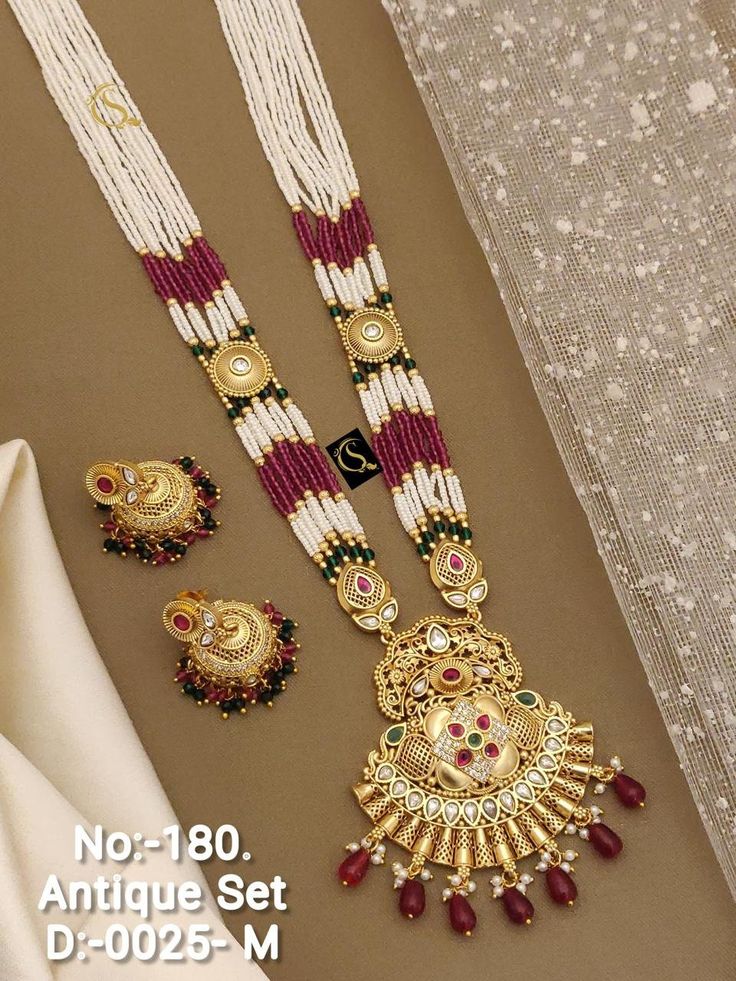 Description :- Indian Necklace Sets, Wedding Jewelry/ Indian Jewelry/ Gold Bridal Kundan necklace Set Indian Wedding Bridal Jewellery Necklace Gift yourself a royal look with this perfectly crafted necklace set from Manalisstudio. Crafted with high quality Beads, stones, it is impressive in design. The green enamel artwork adds perfect texture to the design. Perfect for weddings and festivities, this antique necklace set should be put on with your favorite sari or lehenga. 100% Satisfaction. Lon Luxury Hand Set Elegant Temple Necklace, Maang Tikka With Earrings, Indian Jewelry Gold, Wedding Jewelry Indian, Schmuck Gold, Necklace Combo, Bridal Jewelry Necklace, Wedding Necklace Set, Kundan Necklace Set