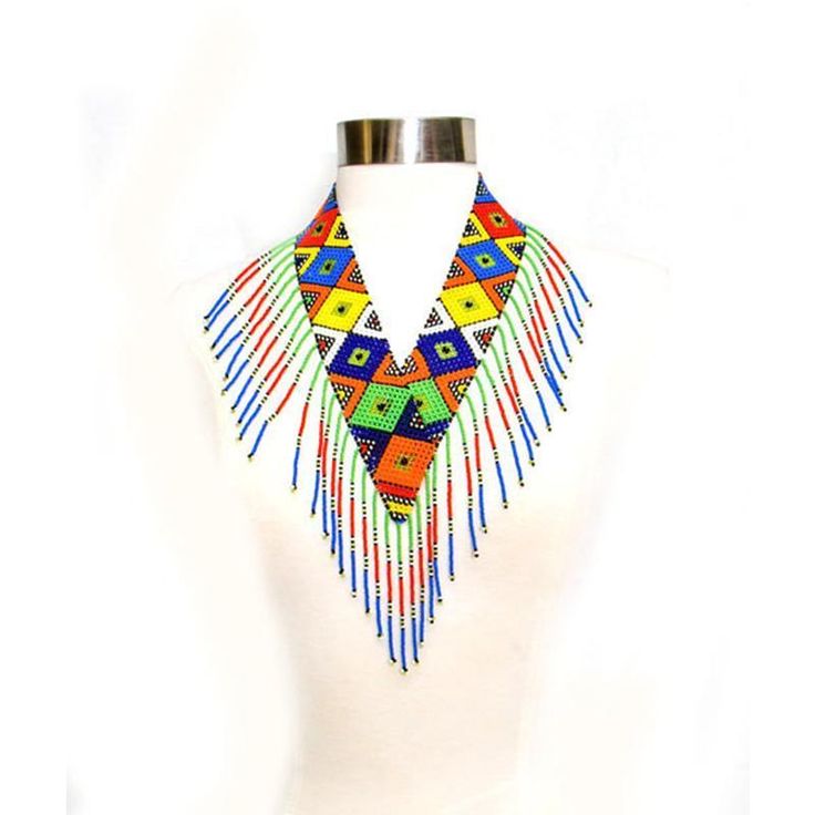 This beautiful beaded bold and authentic colored necklace is handmade by the Maasai women. We directly work with Maasai artisans to produce and market high-end beaded jewelry based on traditional beading techniques infused with modern aesthetics. Maasai women are skilled artisans who are world wide known for their use of colorful glass beads. Maasai culture is highly patriarchal and it is the women who are hurt the most by issues of structural inequality. With us working directly with them, they Traditional Handwoven Beaded Necklaces For Festivals, Artisan Handwoven Beaded Necklaces For Festivals, Traditional Beaded Necklaces For Jewelry Making, Traditional Handwoven Beads For Jewelry Making, Artisan Beaded Necklaces For Festivals, Traditional Beaded Necklaces With Dangling Round Beads, Traditional Beaded Necklace With Dangling Round Beads, Adjustable Traditional Beaded Necklaces With Polished Beads, Round Beaded Necklaces For Festivals