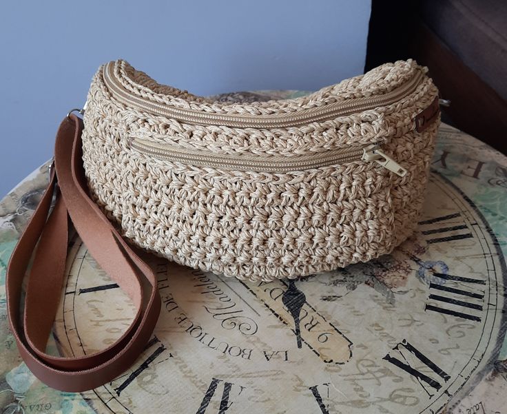 "Add a touch of uniqueness to your style and enjoy hands-free convenience with the \"Beige Waist (Freebag) Bag\". Revel in the elegance of crochet craftsmanship as every detail of this bag has been carefully designed for a distinct look. 📏 Measurements: Width: 25 cm 9,84 inches Height: 11 cm 4,33 inches Depth: 6 cm 2,36 inches Waist Circumference: One Size Fits All 🌟 **Features -Faux leather strap adds both style and comfort while carrying your bag. -Crocheted using eco-friendly double-layered recycled paper yarn, making it an environmentally conscious choice. -Lined interior helps you keep your belongings organized. -Front zippered pocket securely stores your essentials. -Zipper closure provides both security and practicality. This crochet bag is a blend of elegance and functionality, m Summer Beach Shoulder Bag With Cell Phone Pocket, Casual Handmade Bag With Adjustable Strap, Casual Handmade Bags With Adjustable Strap, Bohemian Crochet Mobile Phone Bag For Summer, Casual Handmade Adjustable Shoulder Bag, Casual Adjustable Handmade Shoulder Bag, Bohemian Natural Shoulder Bag With Phone Holder, Everyday Bohemian Pouch Straw Bag, Handmade Summer Pouch Shoulder Bag