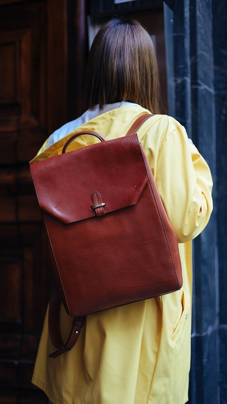 This handmade leather backpack is made with 100% natural full grain leather which is tanned with all natural materials. There is no chemical materials in this leather.  This backpack is handmade in our studio in Milan.  The backpack has one main compartment. There is One small zipped pocket in one side and one cellphone pocket in other side.  back side of the backpack has a outer pocket that has magnetic closure . All the bags will come with a cotton dust bag which can protect the leather and bag when it is not in use.  In options u can find Protection cream to add to your purchase. It will make the bag waterproof and will renew it after some use.  Dimensions :  Wide: 25.5 Cm / 10 inches Hight: 37.5 Cm / 14.7 inches  Deep: 11 Cm / 4.3 inches  it can hold up to 15' laptops Everyday Backpack In Vegetable Tanned Leather, Everyday Vegetable Tanned Leather Backpack, Everyday Leather Backpack With Smooth Grain, Daily Use Leather Backpack With Smooth Grain, Daily Use Vegetable Tanned Leather Backpack, Brown Smooth Grain Standard Backpack, Brown Leather Backpack With Smooth Grain, Everyday Brown Vegetable Tanned Leather Backpack, Handmade Backpack