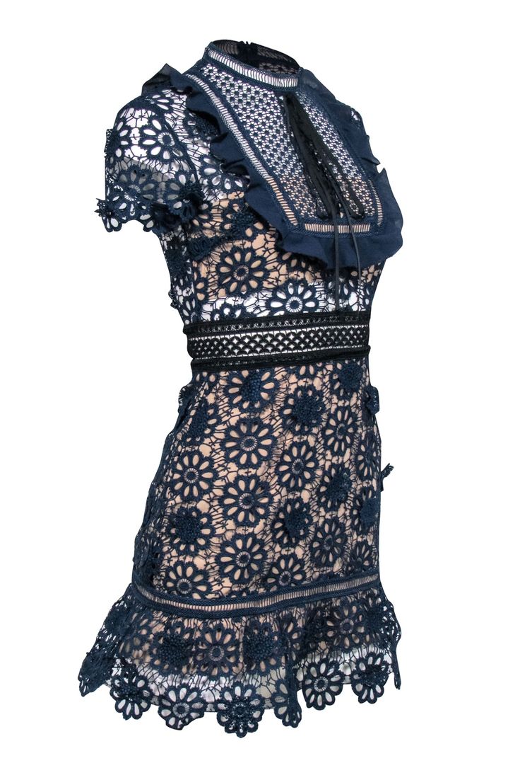 Ready to make a statement at your next cocktail party? Slip into this navy lace eyelet short sleeve dress from Self-Portrait, paired perfectly with black strappy heels. This dress is both elegant and fun, making you the center of attention at any event. Size 2 Shell 97% Polyester, 6% Polyamide Lining 97% Polyester, 3% Spandex Invisible zipper back Short sleeve Semi sheer details Black lace up tie detail Mock neck Ruffle trim Bust 34" Waist 27" Shoulder to hem 33" Sleeve length 7" Elegant Short Sleeve Eyelet Dresses, Short Sleeve Mini Dress With Lace Trim For Evening, Lace Mini Dress With Short Sleeves For Night Out, Spring Lace Dress With Short Sleeves For Night Out, Spring Short Sleeve Lace Dress For Night Out, Summer Lace Dress With Short Sleeves For Night Out, Summer Short Sleeve Lace Dress For Night Out, Short Sleeve Lace Dress For Summer Night Out, Chic Scalloped Lace Short Sleeve Mini Dress