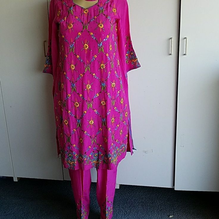 Pink Salwar Call Rani Embroidered Multicolored Flower Designs With Multi-Colored Stone Work Embroidery On Sleeves And Bottom Of Pants Scarf Is Pink With Blue Braid All Around. Fabric Is Crepe Silk Bust Is 48 Inch Spring Floral Print Pink Salwar Kameez, Silk Salwar Kameez With Intricate Embroidery In Pink, Pink Silk Salwar Kameez With Intricate Embroidery, Fitted Pink Floral Embroidered Set, Fitted Pink Sets With Floral Embroidery, Summer Straight Kurta Dress With Multicolor Embroidery, Summer Multicolor Embroidered Straight Kurta, Pink Sets With Resham Embroidery For Spring, Pink Spring Sets With Resham Embroidery