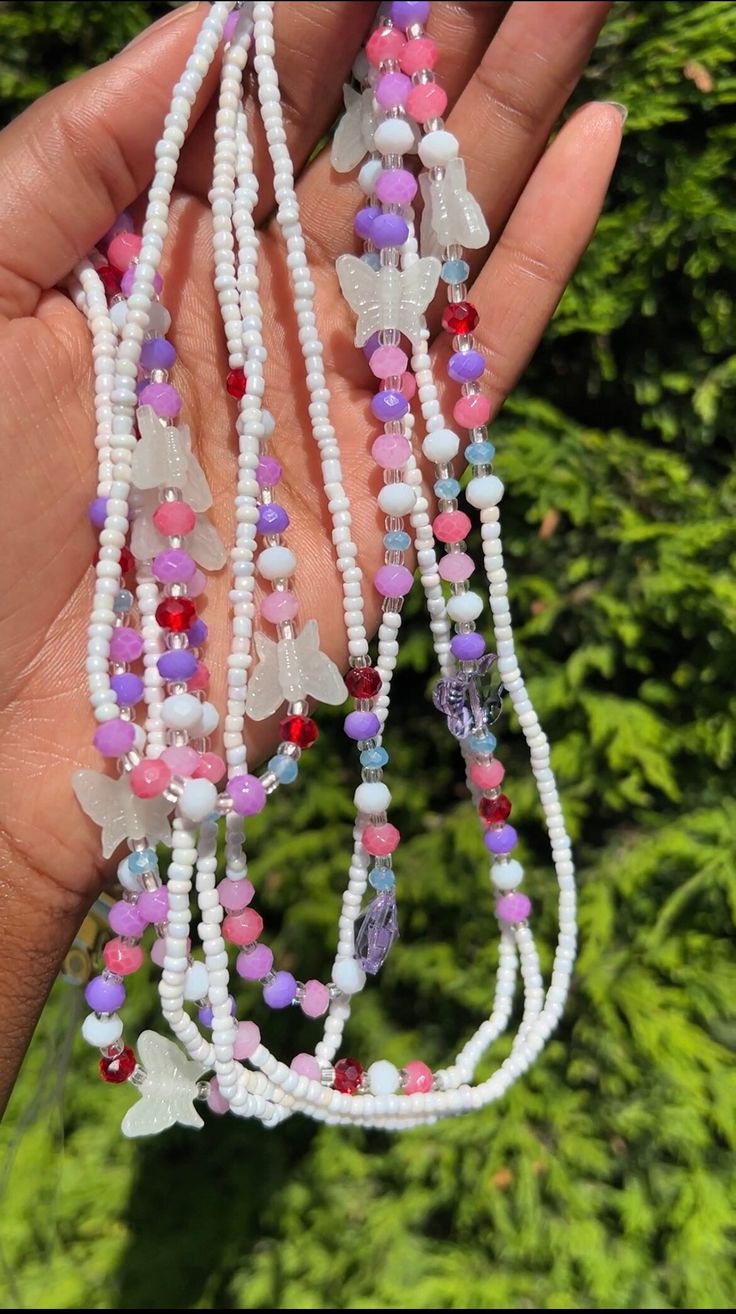 1 strand waist beads per option Luna Pink - Iridescent White and patterned with Blush Pink beads Muna - Butterfly Glow-in-the-dark beads, iridescent white and an array of pink, blue, red beads and light purple butterfly Imani - Iridescent White and patterned with mixed sizes Hot Pink beads   If size not listed, just pop a note in the notes box at check out and the changes will be made for you!   Available on Elastic String or Tie-on   Actual product colour may vary dependant on screen capabiliti Festival White Beaded Chain Waist Beads, Adjustable White Beaded Chain Waist Beads, Adjustable White Beaded Waist Beads, Adjustable White Waist Beads, Summer White Beaded Necklaces With Spacer Beads, White Tiny Beads Waist Jewelry For Festival, White Beaded Chain Bracelets For Summer, White Beaded Waist Beads As Gift, White Beaded Waist Beads As A Gift