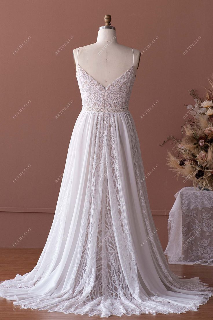 a white wedding dress on a mannequin