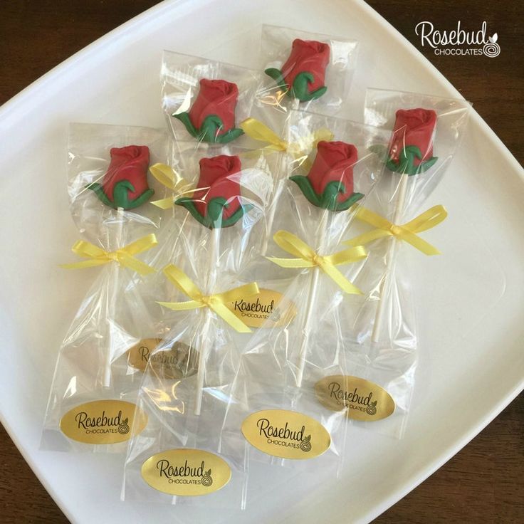 chocolate roses wrapped in cellophane on a plate