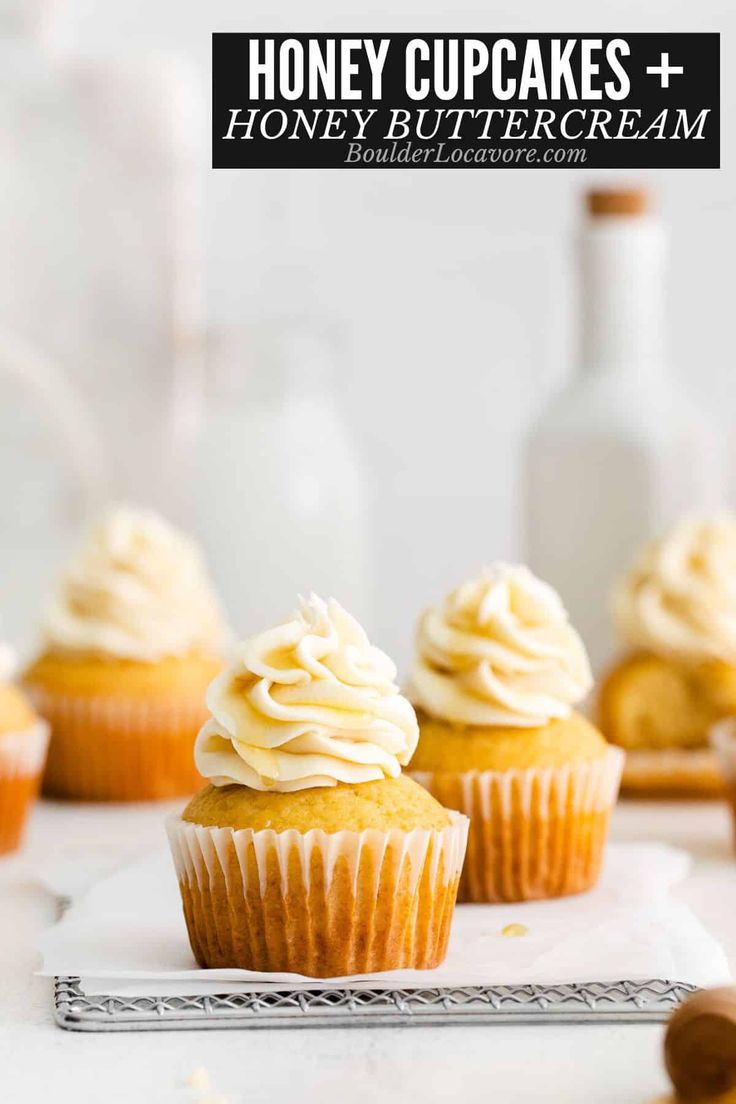 honey cupcakes with buttercream frosting on top