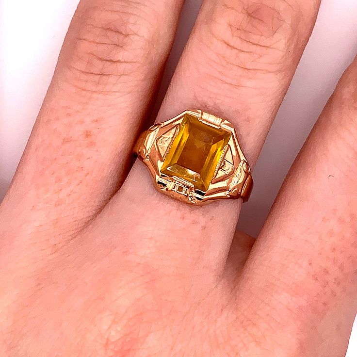 Vintage 1940's 10k yellow gold yellow stone ring. The ring size is a loose 9, and can be resized. The height of the ring off of the finger is 3.9mm. The width of the band is 3.7mm, and tapers down to 2.8mm. Antique Emerald Ring In Stamped 14k Yellow Gold, Yellow Topaz Center Stone Ring In 14k Gold, Antique Engraved Yellow Gold Ring With Gemstone, Vintage Yellow Gold Sapphire Ring Collectible, Estate Style Oval Yellow Gold Rings, Oval Yellow Gold Estate Rings, Classic Yellow Gold Citrine Birthstone Ring, Classic Citrine Birthstone Ring In Yellow Gold, Antique Yellow Gold Ring With Center Stone