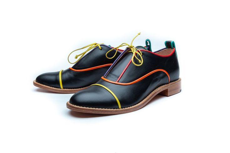 These women's black flat derby shoes ispired by men's shoes, they feature a classic derby design with a flat heel and a single lace-up front. The black leather provides a timeless and versatile base for the shoe, while the colorful piping adds a pop of color and a unique twist to the design. The piping is carefully crafted from high-quality materials in a range of bright and bold colors, including yellow, orange, red purple and green. The piping runs along the seams of the shoe, adding a subtle Black Lace-up Shoes For Office In Spring, Black Dress Shoes With Leather Sole For Spring, Black Oxfords With Leather Sole And Flat Heel, Black Oxford Lace-up Spring Shoes, Black Oxford Lace-up Shoes With Rubber Sole, Black Oxfords With Rubber Sole For Spring, Black Lace-up Shoes With Leather Sole For Spring, Black Slip-on Oxfords With Contrast Sole, Spring Cap Toe Oxfords With Rubber Sole