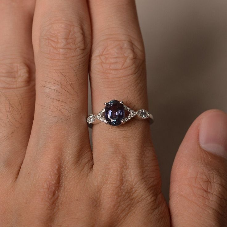 This is a gorgeous handmade creation. Its beauty is its simplicity & Elegance. The 6*8 mm oval shape faceted lab alexandrite is crafted in solid sterling silver and with rhodium plated. All item is sent in a beautiful gift box If you have any idea of design your ring,pls contact me directly. You can realize more lovely stuff clicking the link https://www.etsy.com/shop/knightjewelry?refshopsection_shophome_leftnav Please leave the correct address and you phone number for delivering successful Proposing Ring, June Birthstone Ring, Alexandrite Ring, Gems Art, Hand Ring, June Birthstone, Ring Oval, Proposal Ring, June Birth Stone