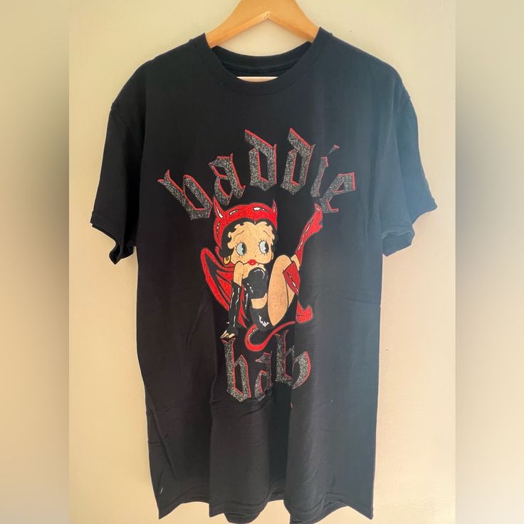 Betty Boop T-Shirt Baddy Baby Graphic Glitter Black Large New Condition: New Without Tags Size: Large Color: Black W Glitter Graphic Approx Measurements Bust: 22” Across Length: 32.5” Betty Boop Black, Betty Boop T Shirt, Betty Boop, Black Red, New Color, Graphic Tees, Black And Red, Womens Tops, Glitter