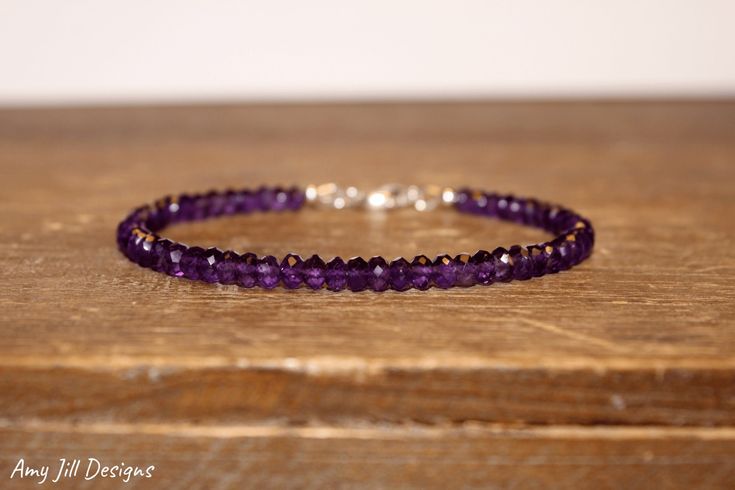 This bracelet features genuine amethyst faceted rondelles. The beads are strung on high quality beading wire and the bracelet closes with a lobster clasp. The color of these stones are absolutely beautiful! A dark gorgeous purple! stones- 4mm Amethyst is the birthstone for the month of February Please select the length that you would like the bracelet to be made. If you would like a different length please message me before purchasing. Magnetic clasps are available in gold, rose gold and silver. Moonstone Bracelet, Sapphire Bracelet, Amethyst Jewelry, Ruby Jewelry, Amethyst Bracelet, Beading Wire, February Birthstone, Purple Stones, Layered Bracelets