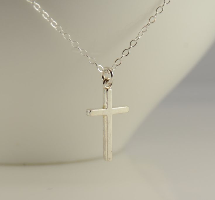 "Cross necklace. Sterling silver cross necklace. Christening gift. Baptism gift, Baptism necklace ♡ Sterling silver cross charm is 3/4\" x 7/16\". ♡ Sterling silver necklace Size chart - girl's necklace average 0 - 24 months 10\"-12\" average 2 - 3 years 13\" average 4 - 5 years 14\" average 5 - 10 years 15\"-16\" average 10 - 16 years 16\"-18\" All of the findings are sterling silver. The necklace will arrive in a nice gift box, ready for delivery. To see more children jewelry click on the link Sterling Silver Necklace For First Communion, White Sterling Silver Necklace For First Communion, Sterling Silver Cross Pendant Necklace For First Communion, Sterling Silver Cross Necklace For First Communion, Silver Cross Pendant Jewelry For Baptism, Silver Cross Necklace For Confirmation, White Cross Pendant Necklace For Baptism, Silver Cross Necklace For Baptism, Silver Cross Jewelry For Confirmation