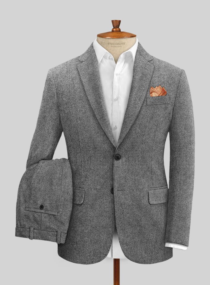 Smart, sharp, and sure to impress, the Light Weight Dark Gray Tweed Suit offers a simple way to achieve a standout look. Crafted from wool, the suit fuses classic patterns with modern, contemporary tailoring that's timeless, stylish, and built to last. Look Includes Light Weight Dark Gray Tweed Fabric Two Button Jacket Formal Tailored Tweed Sport Coat, Tailored Tweed Sport Coat For Formal Occasions, Classic Tweed Suit For Business Casual, Classic Tweed Business Casual Suit, Business Casual Wool Tweed Jacket, Business Casual Wool Tweed Jacket With Pressed Crease, Elegant Fitted Tweed Sport Coat, Tweed Blazer With Herringbone Pattern And Suit Collar, Classic Herringbone Suit For Semi-formal Occasions