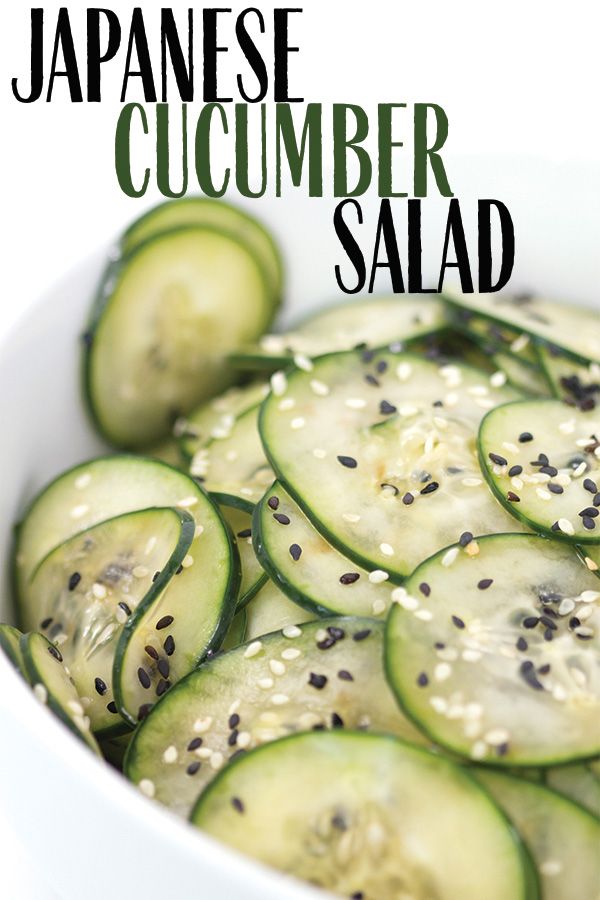 cucumber salad with sesame seeds in a white bowl