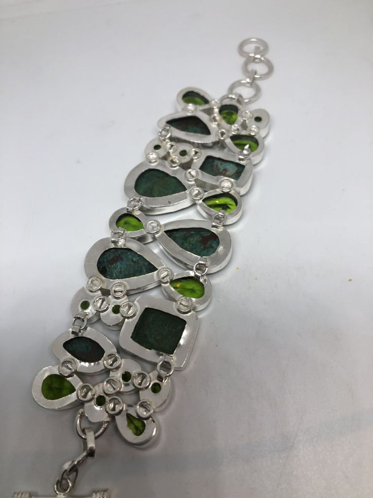 Vintage green gemstone bracelet Hand set in low content silver NOT 925 Bloodstone, Chrysoprase and antique peridot glass About 2 in wide Adjusts 6-8 in All jewelry is shipped in a nice gift box. Check out our over a THOUSAND great reviews Engraving is $4 per letter and is not always perfect depending on the piece. It can take a few days if the jeweler is busy. This is payable to Paypal Judithsltd@gmail.com Unique Nickel-free Green Jewelry, Unique Green Nickel-free Jewelry, Unique Green Bangle Bracelet, Green Cabochon Bracelet For Formal Occasions, Green Bangle Bracelets In Fusion Style, Green Cabochon Bracelets As A Gift, Green Cabochon Bracelets For Formal Occasions, Green Cabochon Bracelets For Gift, Fusion Green Bangle Bracelets